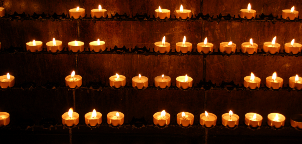 why do catholics light candles