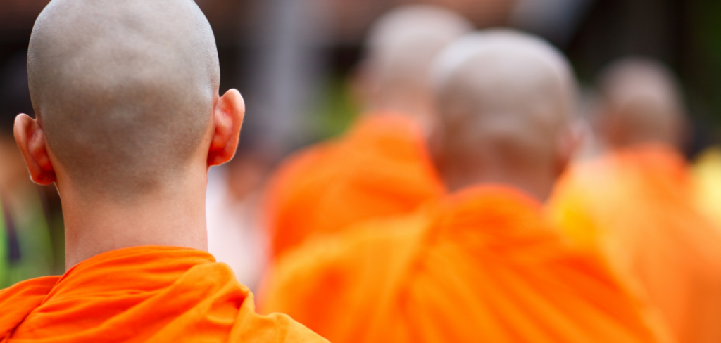 why do monks wear orange